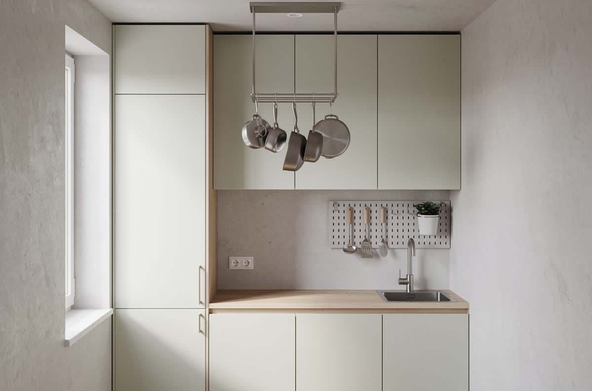 Small kitchen with cabinets running to the ceiling, a pegboard strip and a hanging pot rack