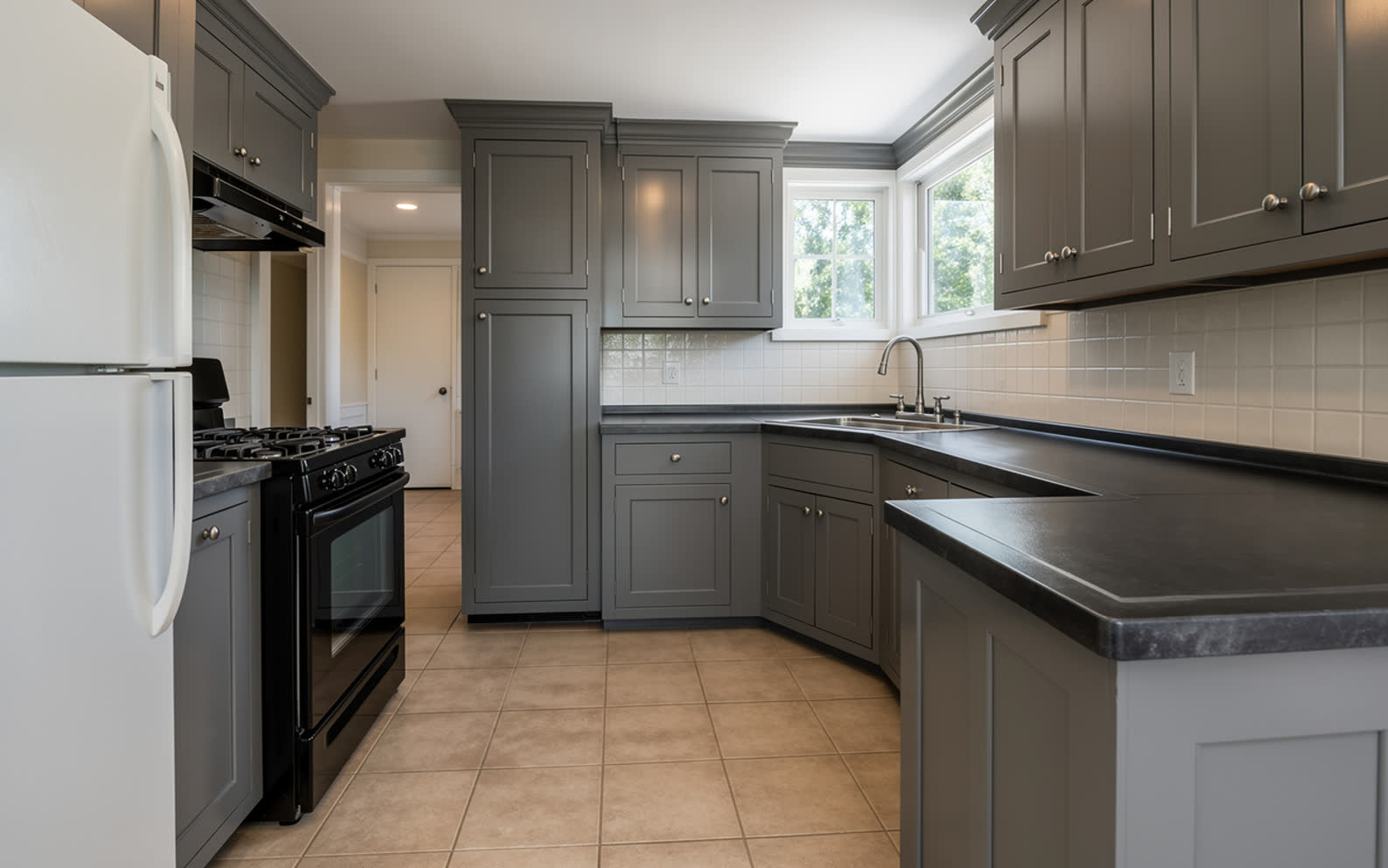The same kitchen with every door repainted warm gray
