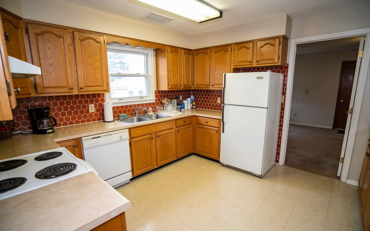 The same kitchen with matte terracotta hexagon tiles