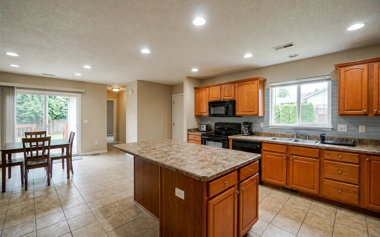 The same kitchen with a soft blue-grey handmade subway tile backsplash